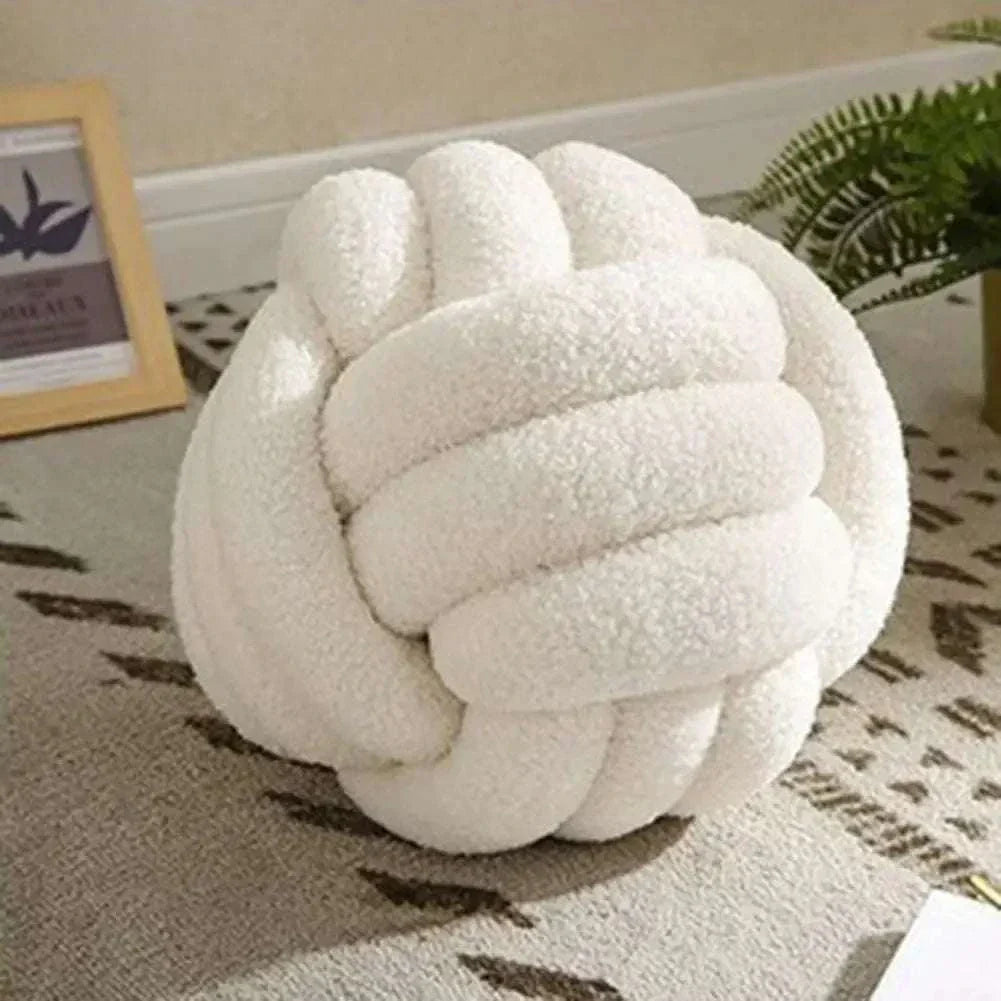 Knotted Ball Pillow for kids' rooms, soft and stylish bedroom accessory.