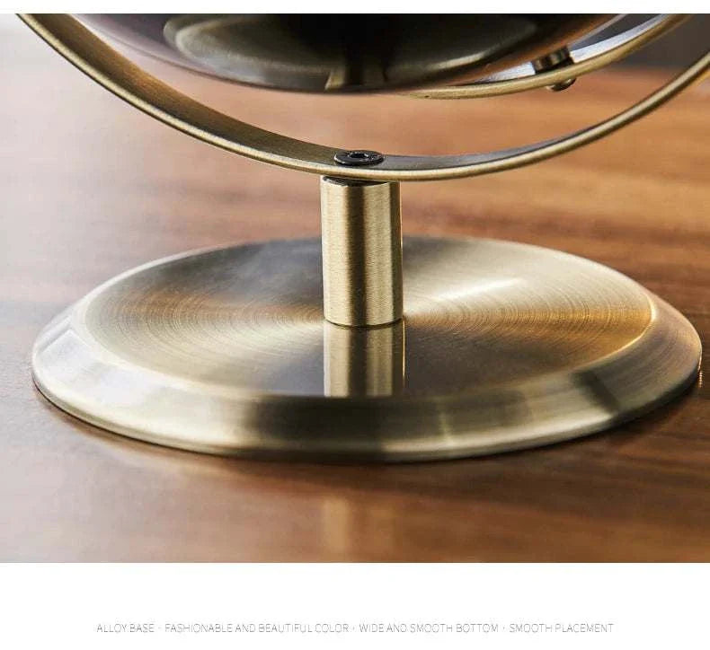 Aya Globes with elegant bronze alloy base for sophisticated decor.