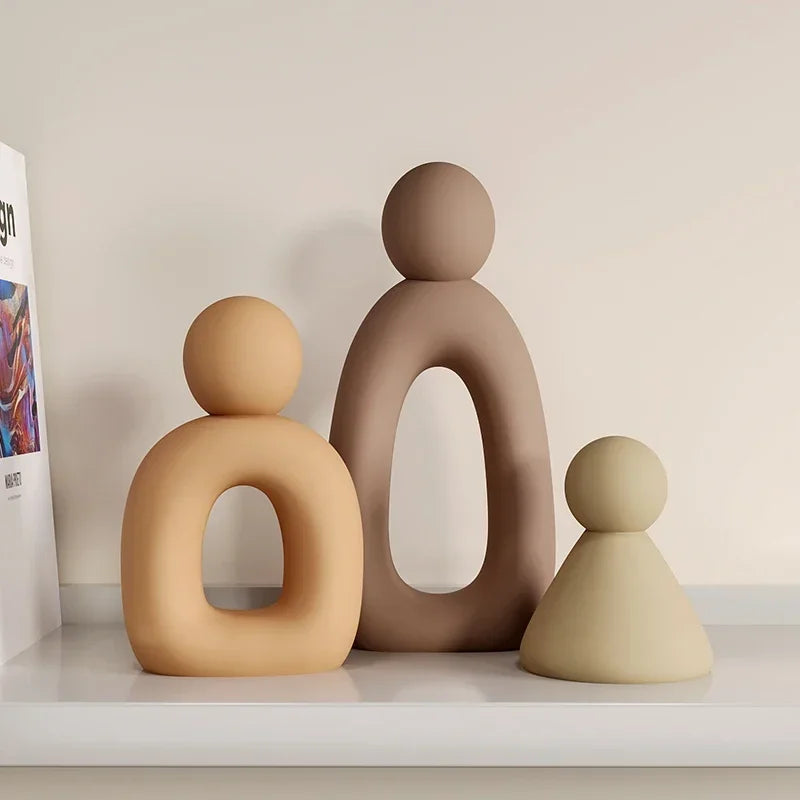 Minimalism Family Statue featuring neutral tones and modern design on a shelf.