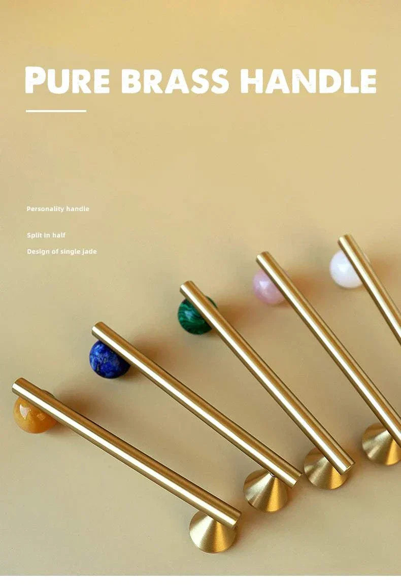 Natural crystal and brass furniture handles for kitchen decor.