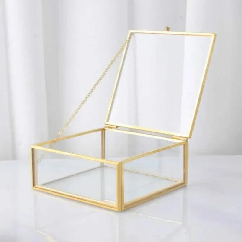 Luxurious Orter trays and box in brass and glass with gold finish, perfect for elegant organization.