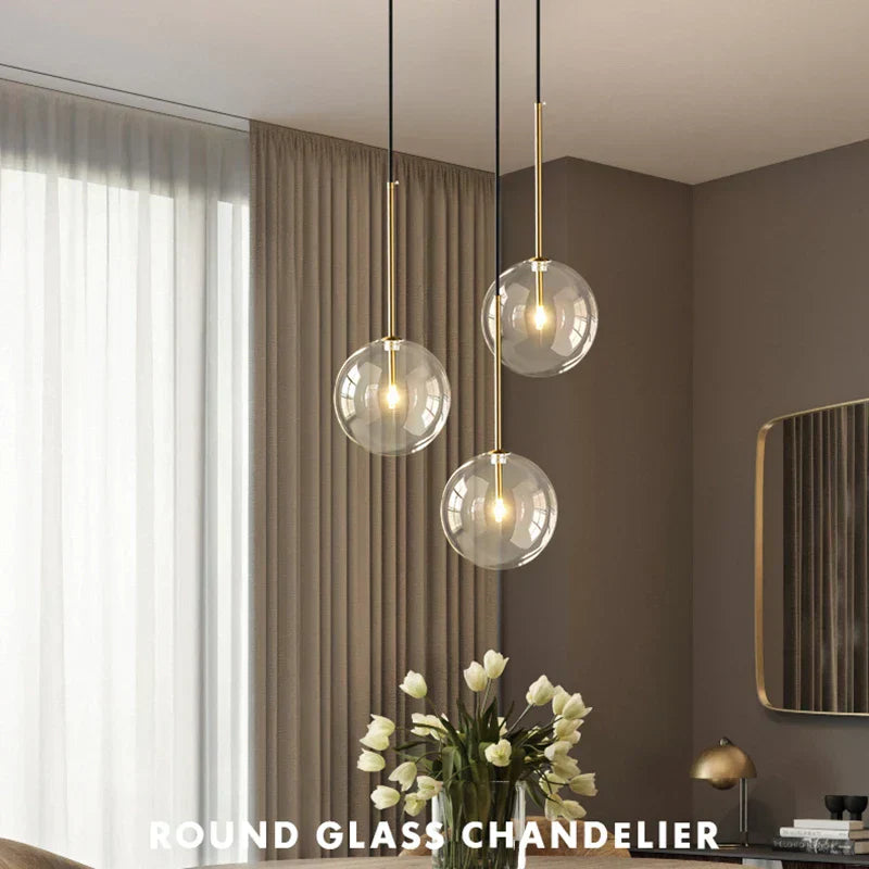 Hanging LED and glass ball Anji lights in a modern room setting.