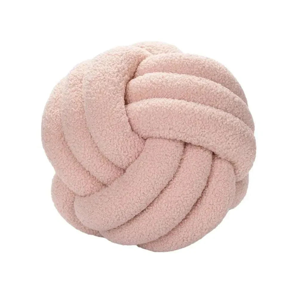 Knotted Ball Pillow for kids' rooms in soft pink, adds comfort and style.