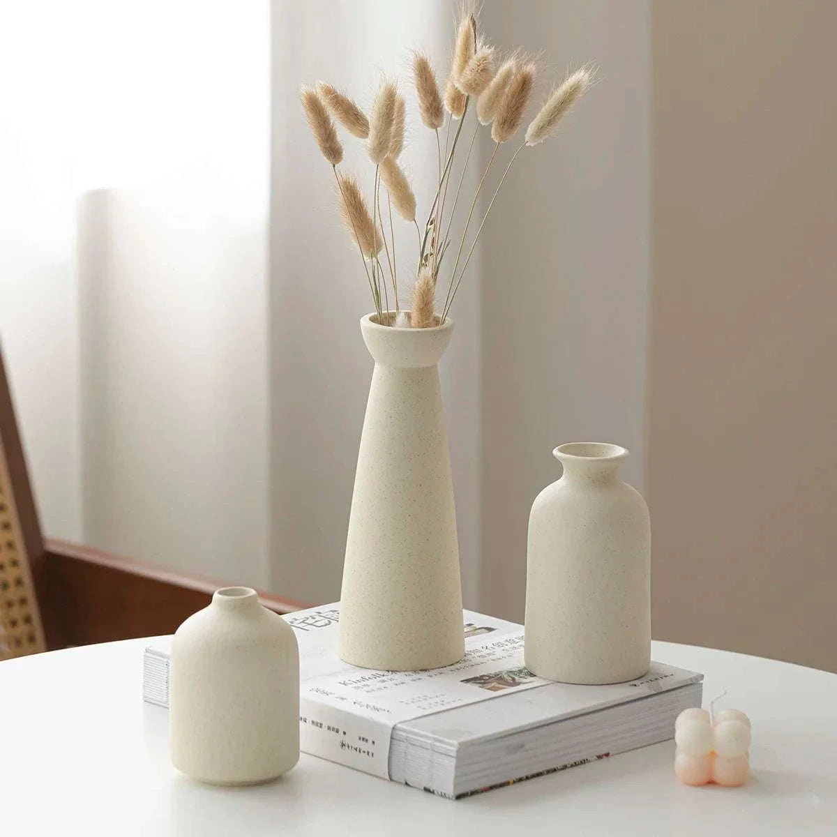 Minimalist cream ceramic Wulf Vases for modern home decor.