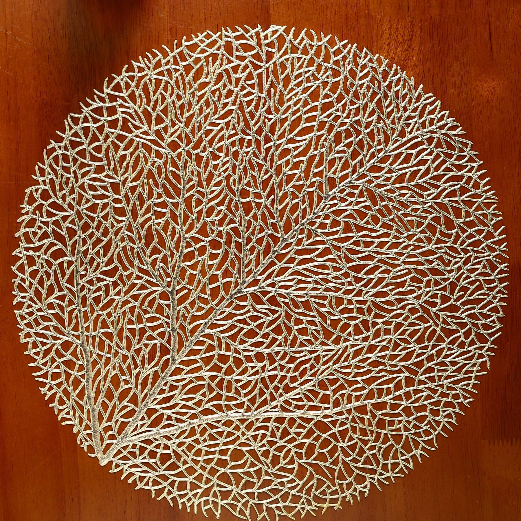 Ollie Placemats set of 4, golden leaf design, PVC hollow insulation coaster pads.
