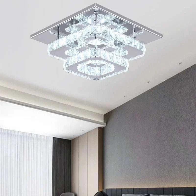 LED Chandelier with crystal ceiling design and chrome finish, semi-flush mount, cool white LED lights, perfect for luxury home lighting.