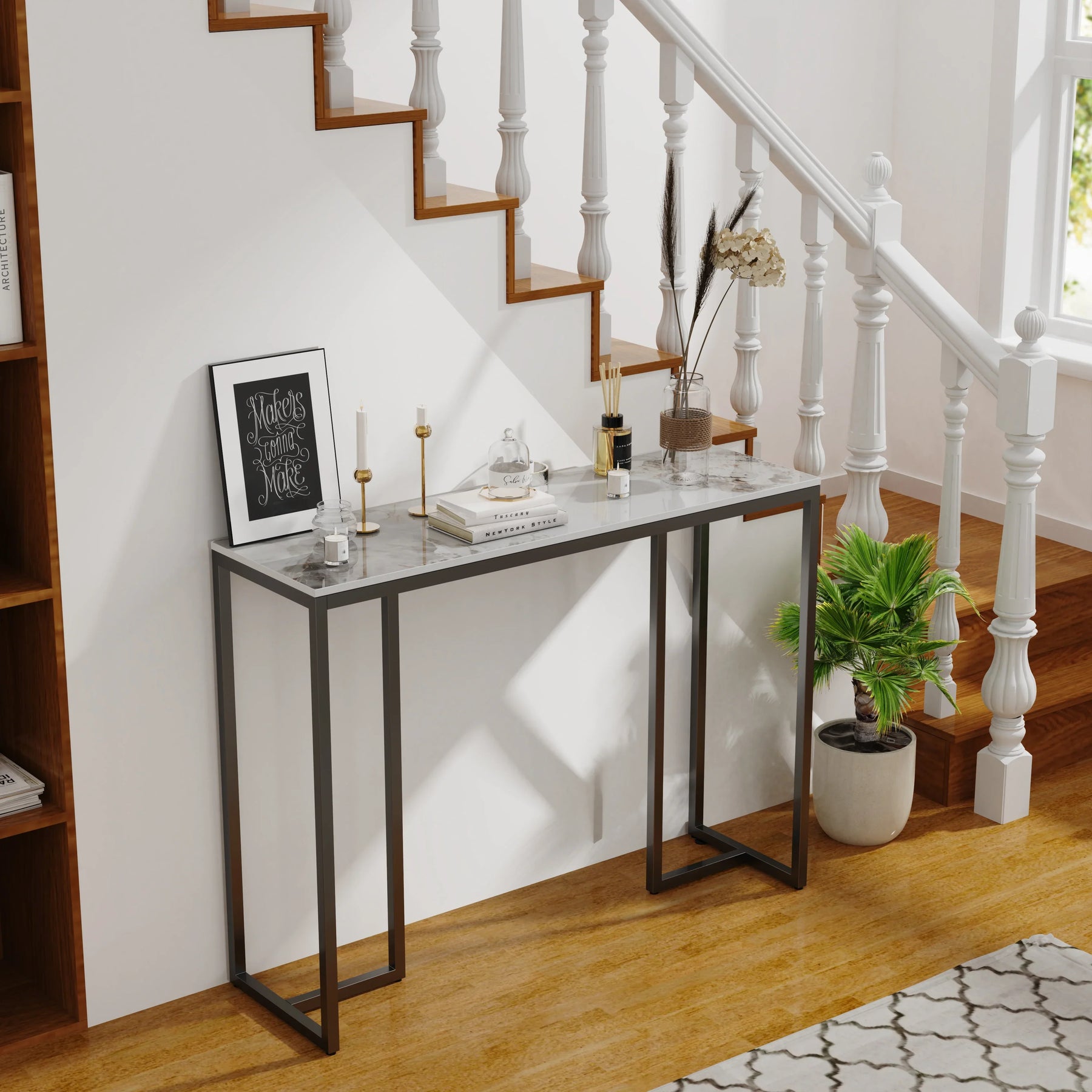 Modern marble console table in entryway near staircase, featuring metal frame and minimalist design.
