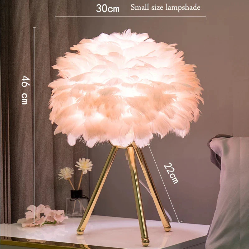Feather Table Lamp with delicate feather lampshade exuding warm glow, placed on a table.
