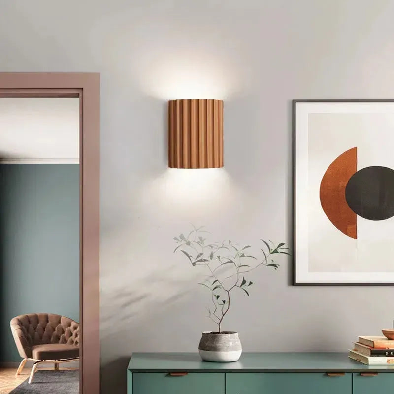 Nordic LED Resin Wall Lamp in grey, illuminating a modern room decor.