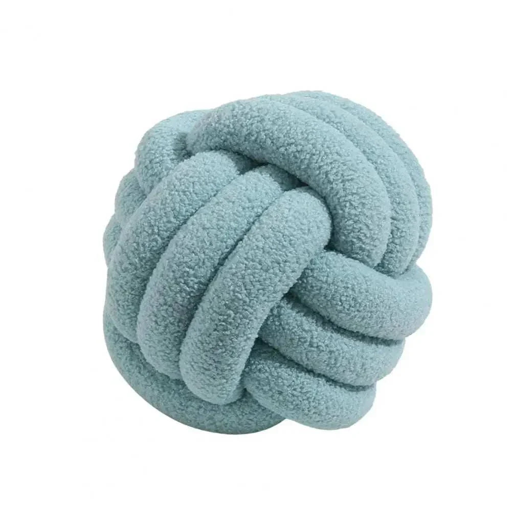 Knotted Ball Pillow in soft blue, ideal for adding comfort and style to kids' rooms.