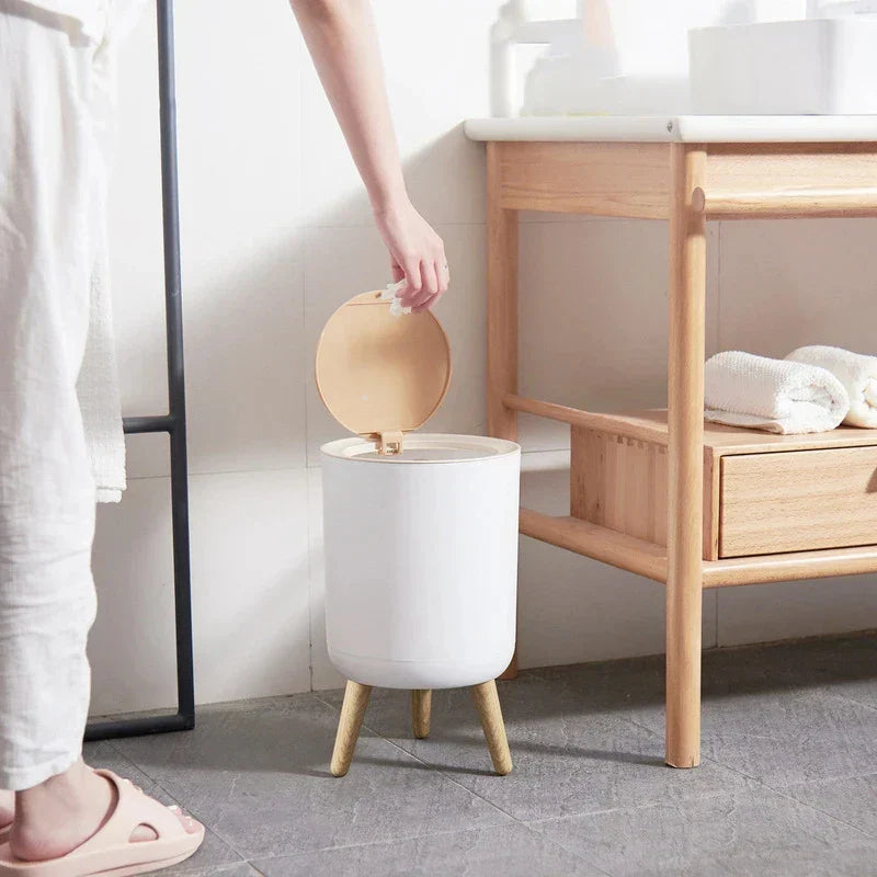 Round Null Trash Can in sleek design beside bathroom sink.