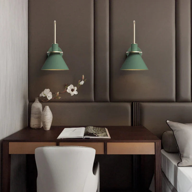 Sleek and modern Dexter wall lamps with adjustable arms in a cozy room setting.