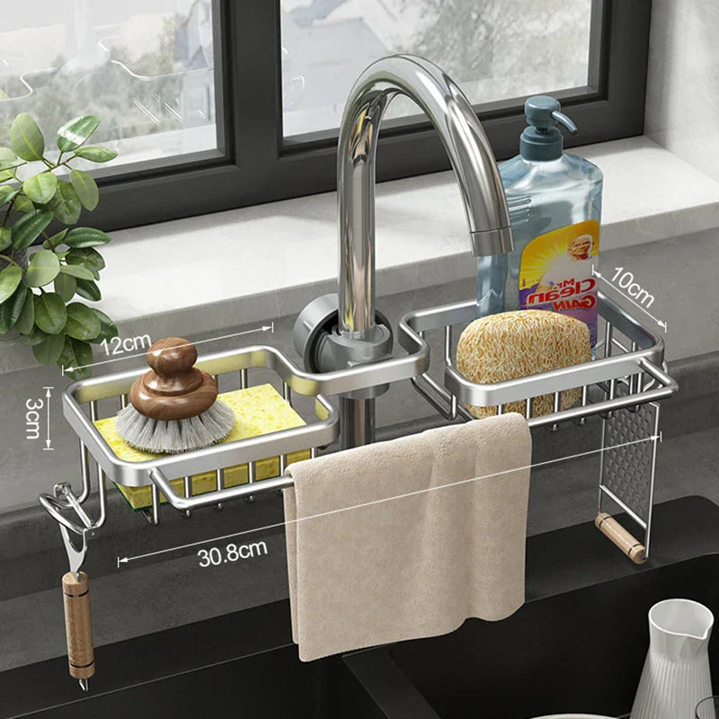 Faucet Soap Drainer attached to kitchen faucet with sponges and brush, maximizing sink space.