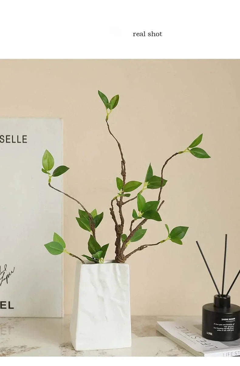 Faux Withered Branches with realistic textures and tender buds in a white vase, ideal for home decor.
