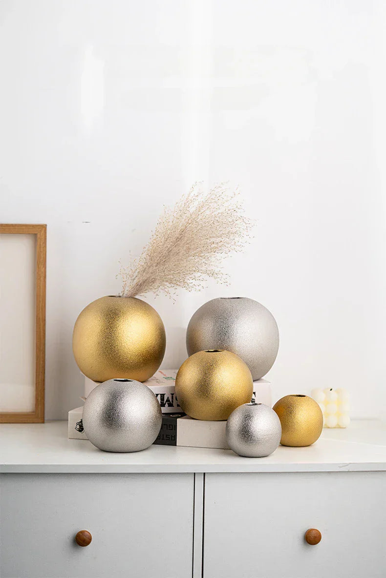 Nuala Ceramic Balls in silver and gold as vases or ornaments.