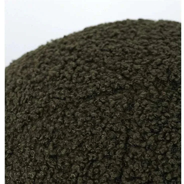 Bubble Kiss soft round pillow in textured fabric, perfect for cozy autumn nights.