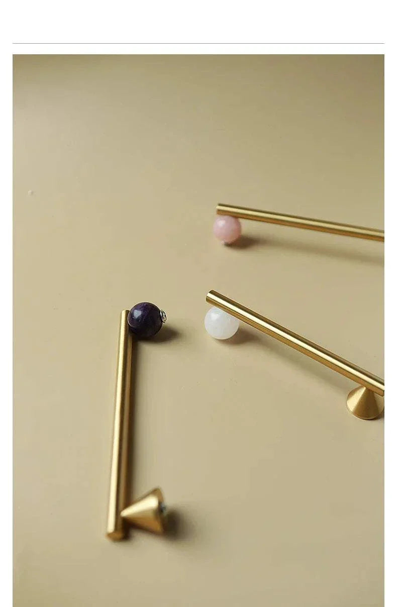 Natural Crystal and Brass Furniture Handles in pink for kitchen cupboards and drawers.