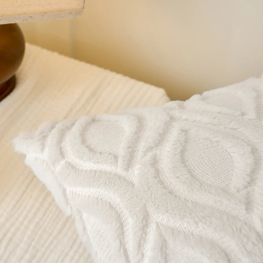 MACT Plush Cushion on beige surface enhancing comfort and softness.