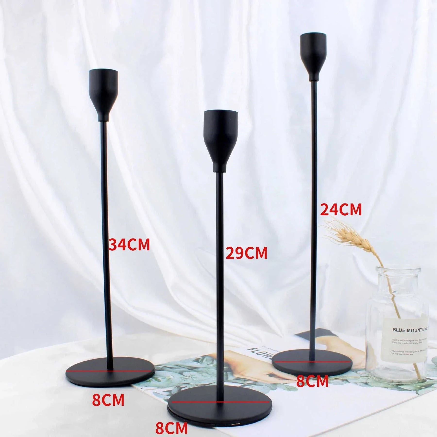 Sleek black Alison Candle Holder set in various heights with durable metal construction for stylish home decor.