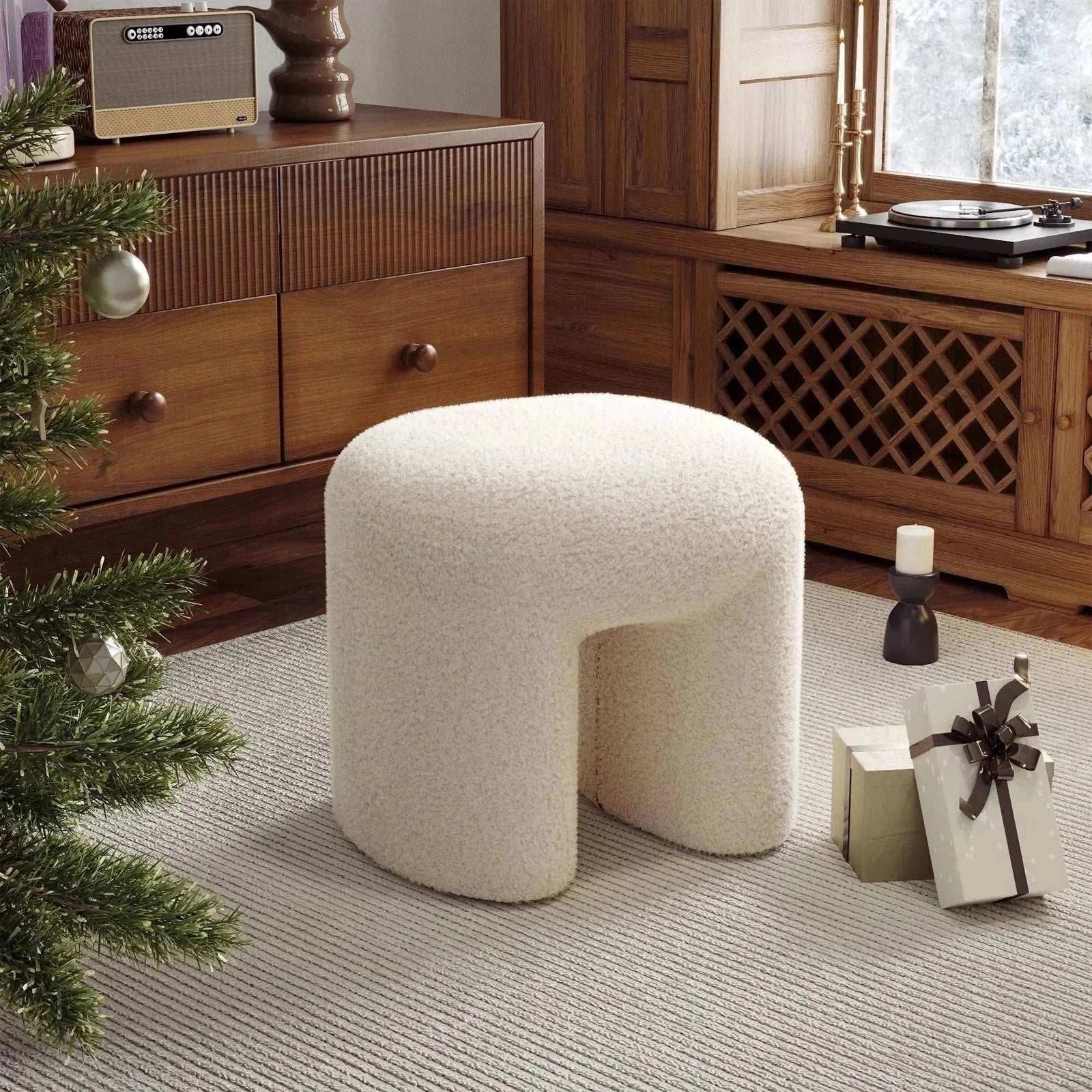 White Theadra Ottoman with teddy bear fur upholstery in a cozy living room setting.