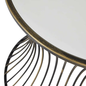 Contemporary concave brass mirrored side table with reflective surface.