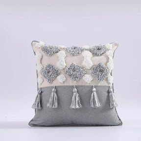 Moroccan style pillow case with intricate patterns and tassels, adding elegance to bedroom decor.