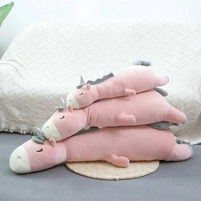 Giant unicorn pillow with ultra-soft materials for kids' comfort and imaginative play.