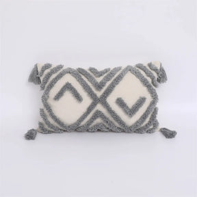 Moroccon style pillow case with intricate gray and white geometric patterns.
