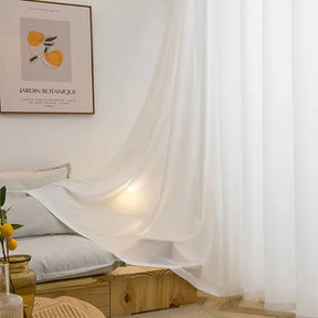 Asazal White Tulle Curtains in a cozy living room setting, filtering natural light.
