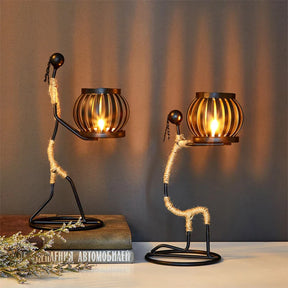 Ewa Candle Holder featuring elegant African woman design with lit candle ambiance.