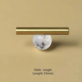 Natural crystal and brass furniture handle for cabinets and drawers.