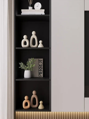Minimalism Family Statue with neutral tones on shelf displaying modern decor.