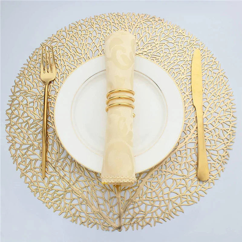 Ollie Placemats set of 4 in golden leaf design, PVC material, perfect for modern table decor.