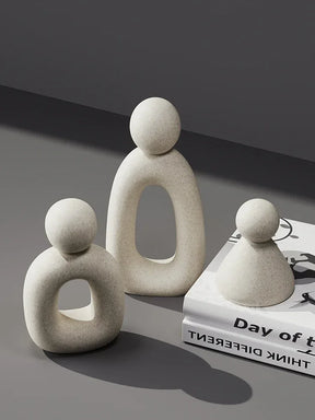 Minimalism Family Statue in neutral tones on a modern surface.