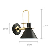 Dexter wall lamps with sleek black and gold design, adjustable arm, and modern style.