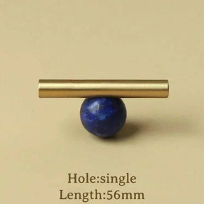 Natural crystal and brass furniture handle for kitchen cupboards and drawers.