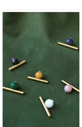 Natural crystal and brass furniture handles for elegant decor.